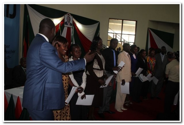 h.e. governor celebrating with the group after being awarded the scholarships